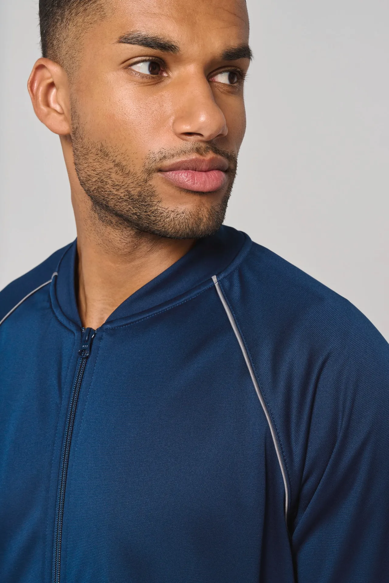 Unisex-Trainingsjacke mit Reißverschluss und Paspel