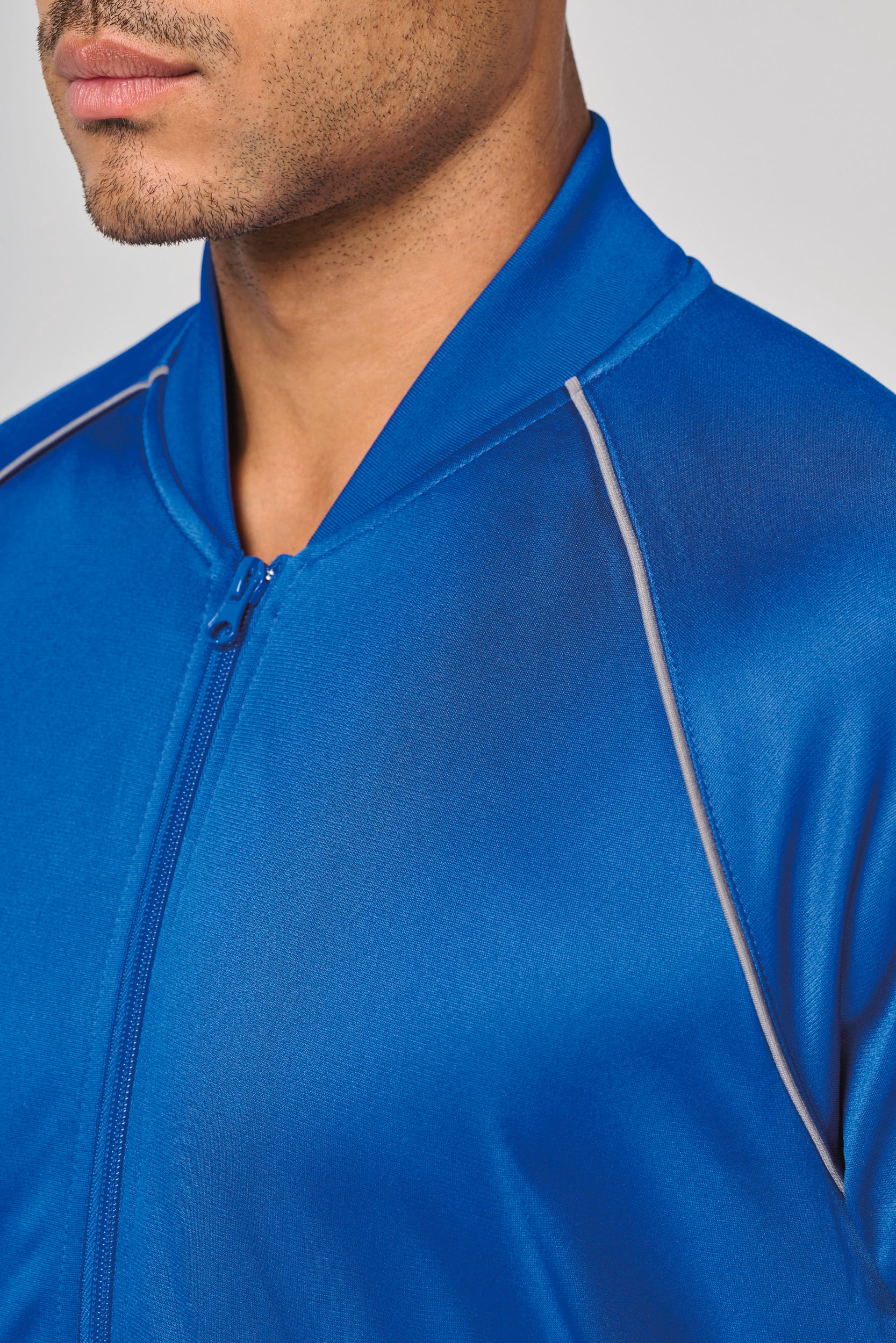 Unisex-Trainingsjacke mit Reißverschluss und Paspel