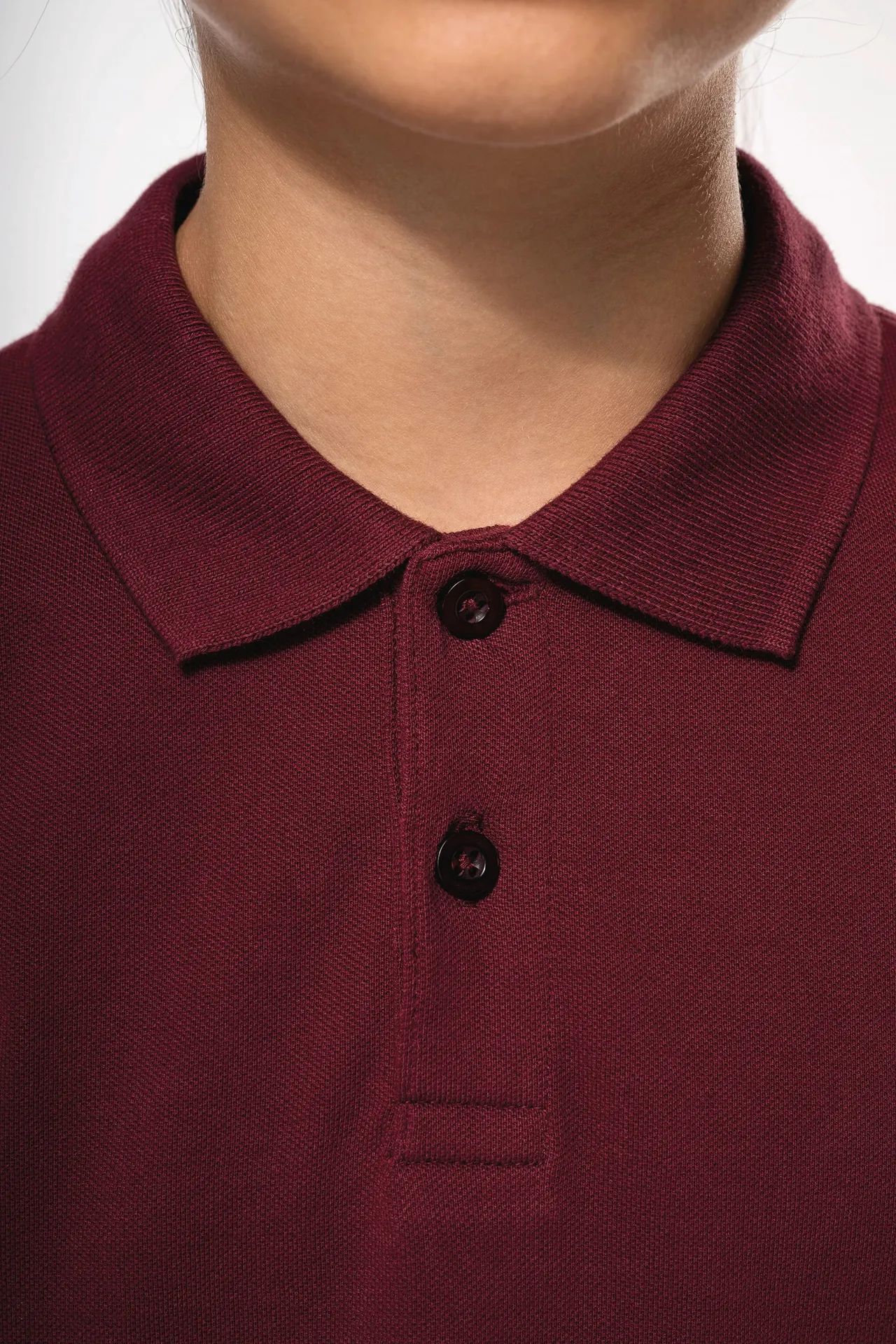 Polohemd mit langen Ärmeln für Kinder.